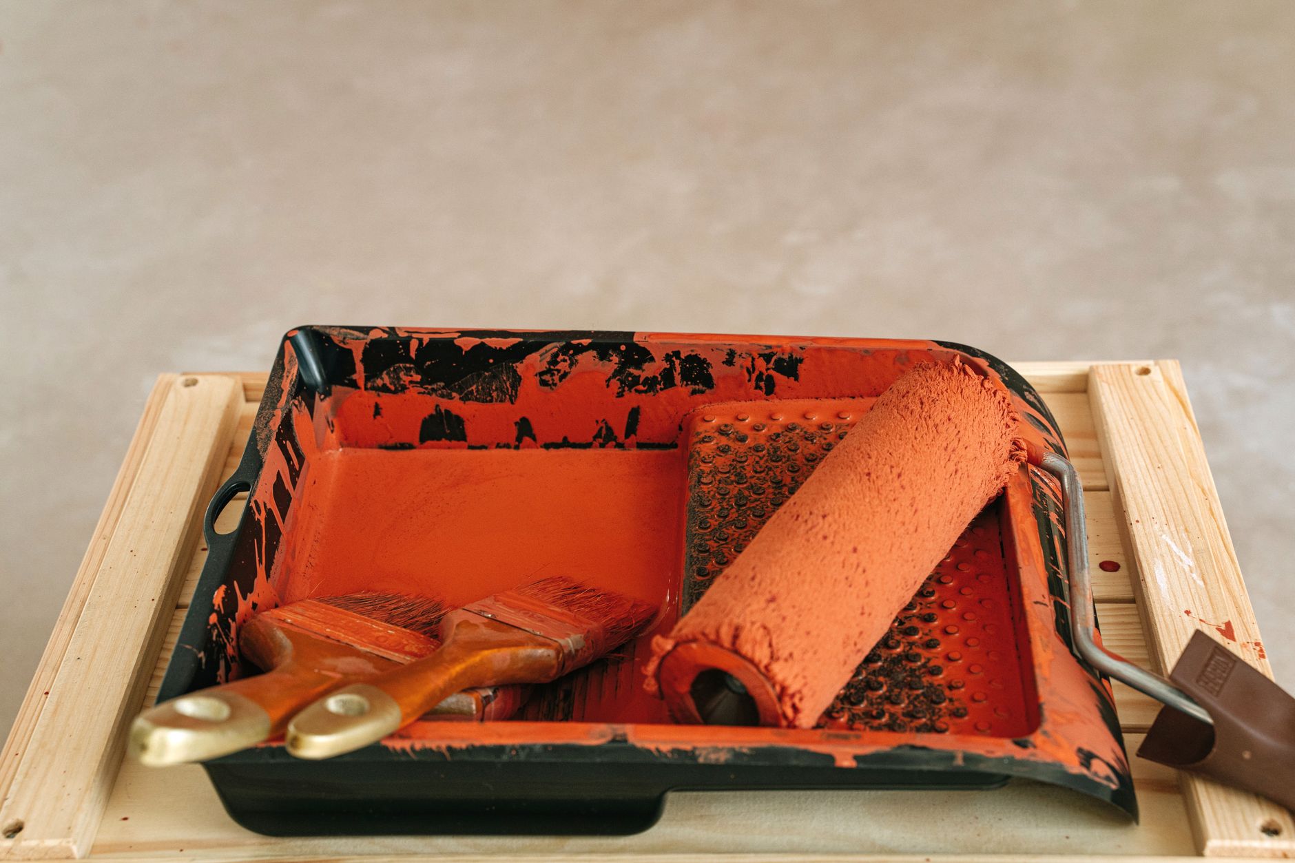 Paint roller and brushes in tray for home renovation and DIY projects in Riverside, CA